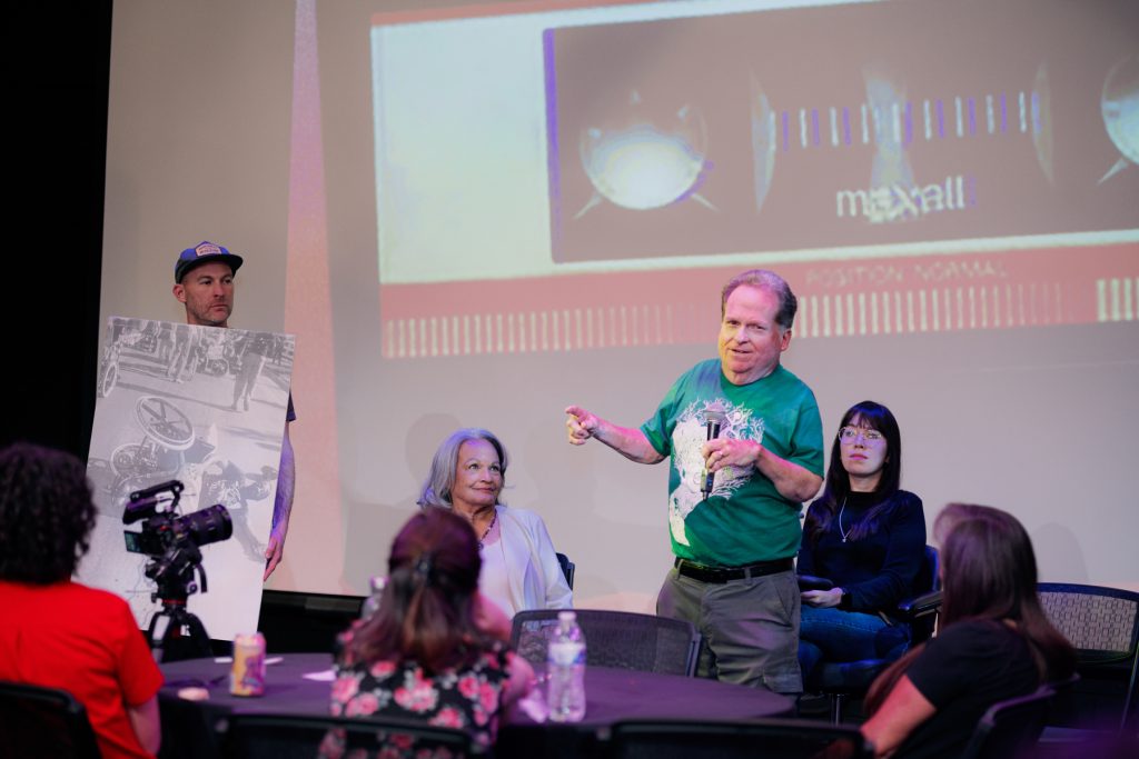 man speaking on stage